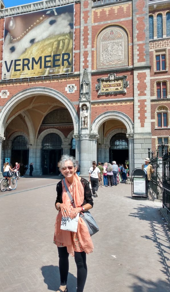 Pamela standing outside the entrance to the Vermeer exhibition which was in the Rijksmuseum during 2023.