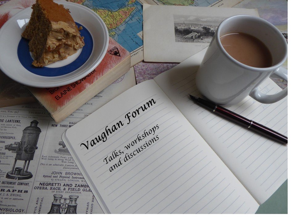 Photo of a mug of tea, a slice of cake on a plate and open note book with 'Vaughan Forum' and 'Talks, workshops and discussions' written in the notebook. The are all sitting on layers of papers, books and images.